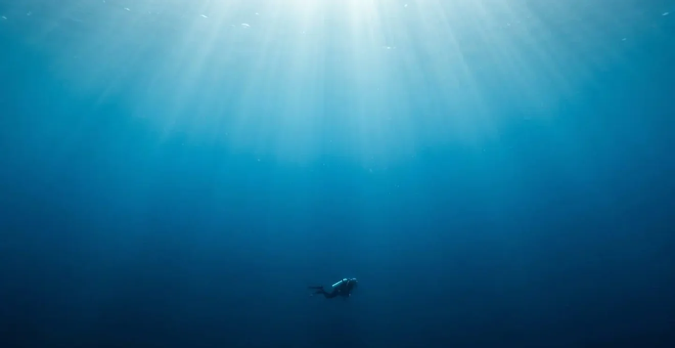 Crystal clear Atlantic Ocean underwater scene with exceptional visibility showing deep blue water and sunlight penetrating the depths